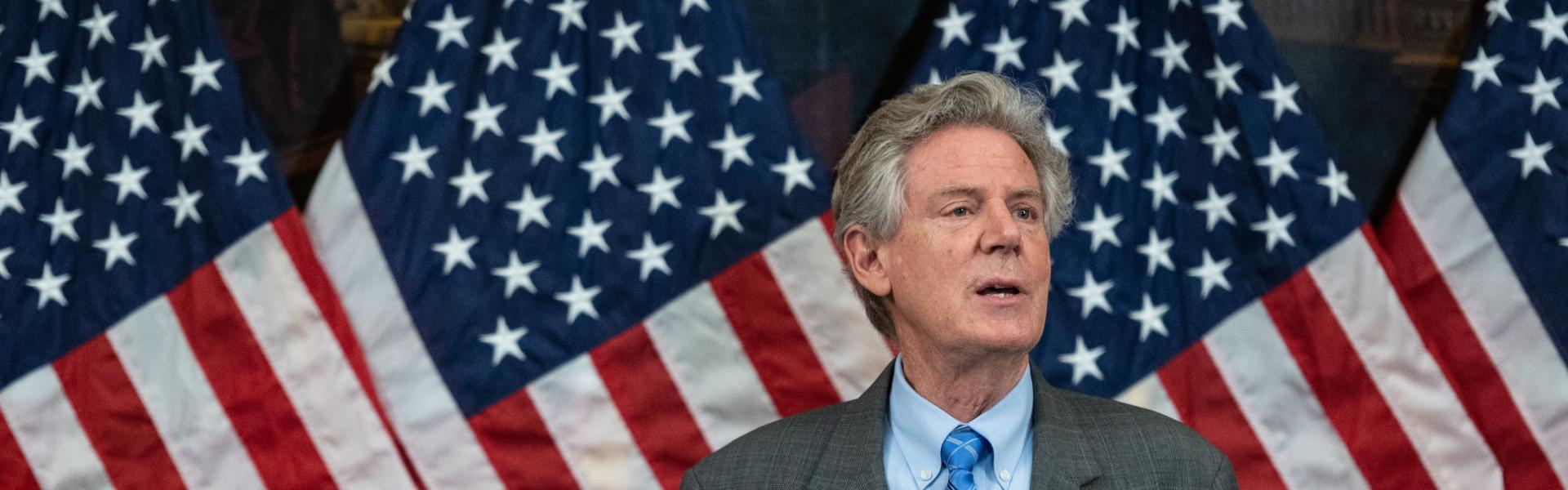 Rep. Pallone speaks in front of US Flags